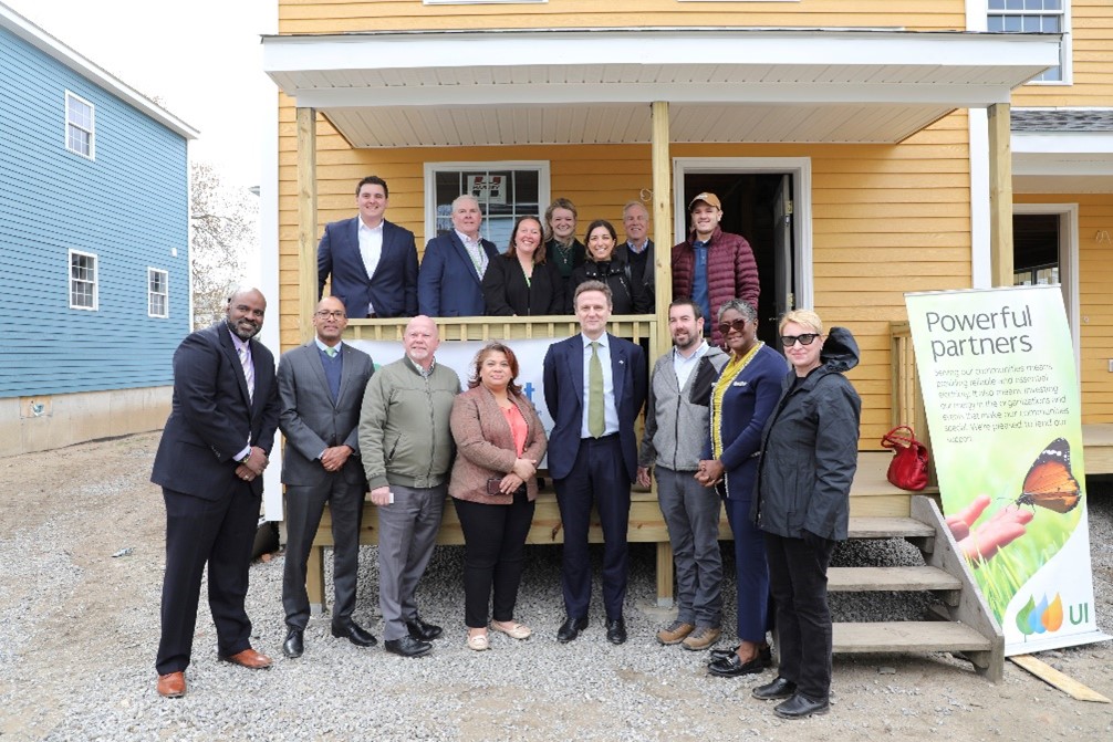 AVANGRID CEO Pedro Azagra (center) joins (from left) United Illuminating President and CEO Frank Reynolds, State Representative Joe Gresko, Bridgeport City Council President Aidee Nieves, and Habitat for Humanity Coastal Fairfield County Chief Operating Officer Kevin Moore at an energy efficient home under construction by Habitat-CFC in Bridgeport on Wednesday, April 19, 2023.